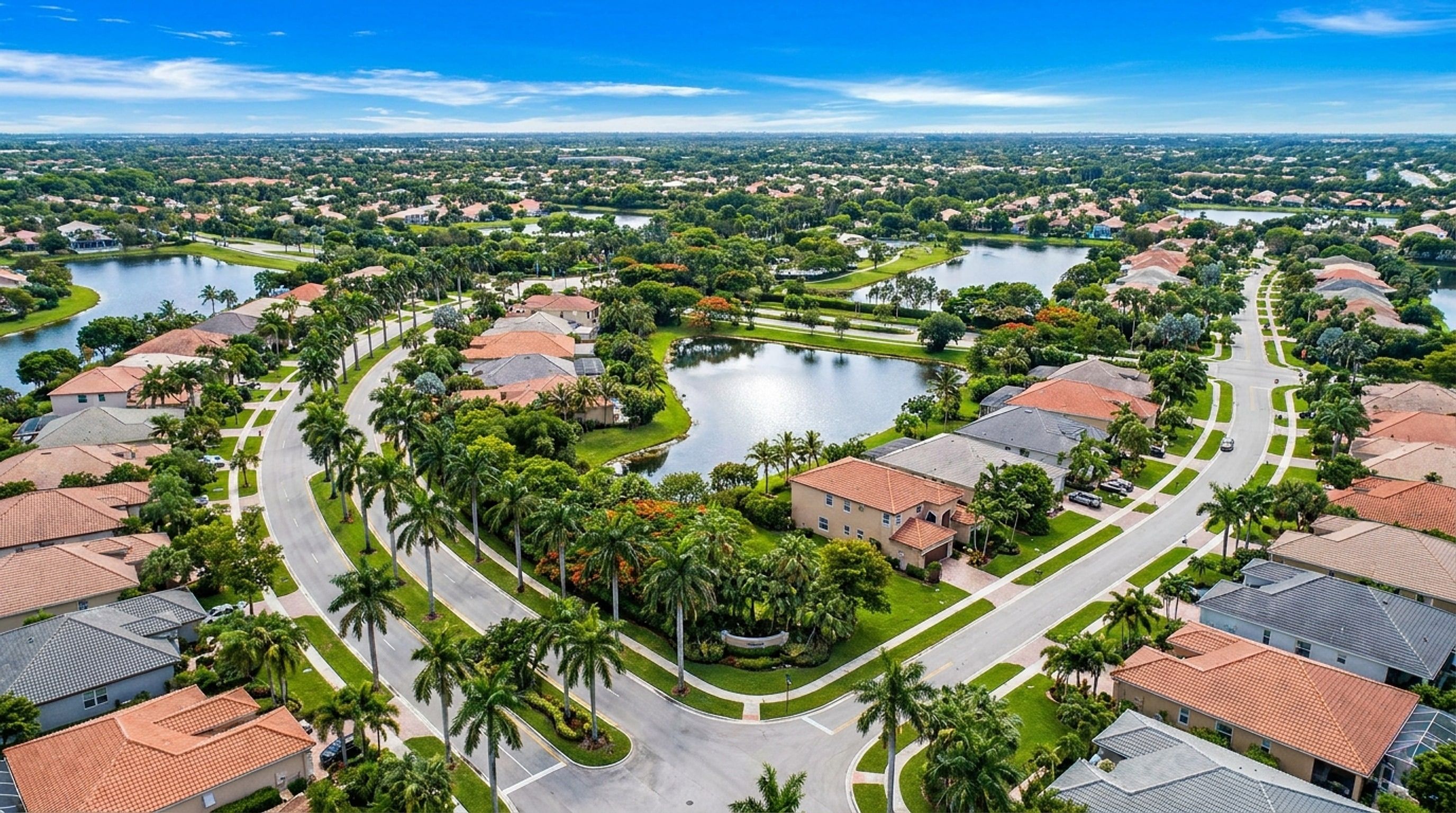Elevated view of Pembroke Pines and Broward neighborhoods with tile-roof homes, lakes, and palms across the service area